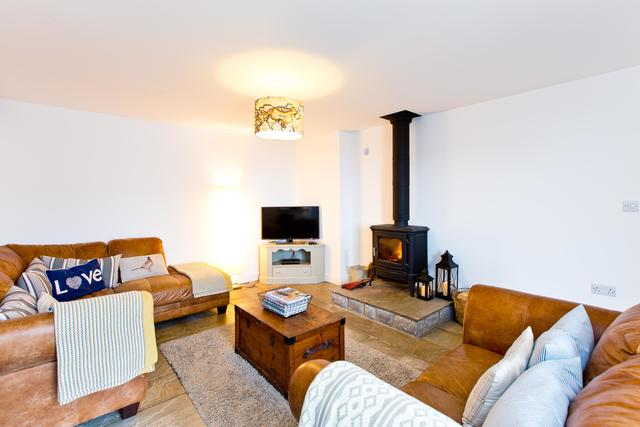 Beautiful lounge with cosy log burner Beautiful lounge with cosy log burner