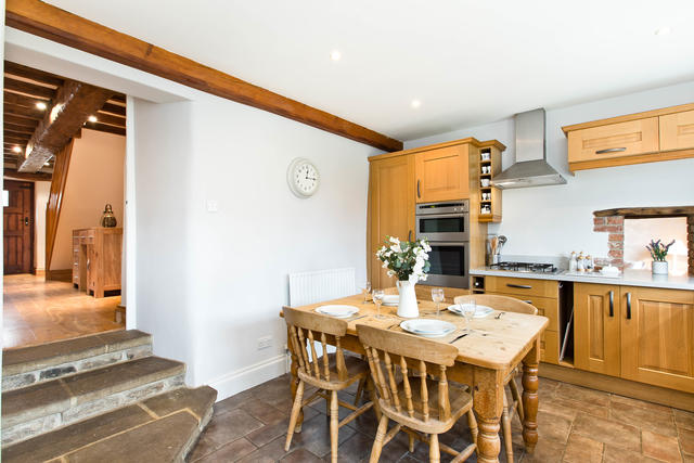 Steps from dining area into kitchen Steps from dining area into kitchen