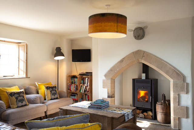 Cosy log burner in open-plan living area