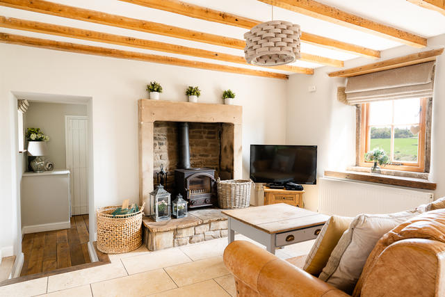 Lounge with working log burner, just off the main farmhouse kitchen