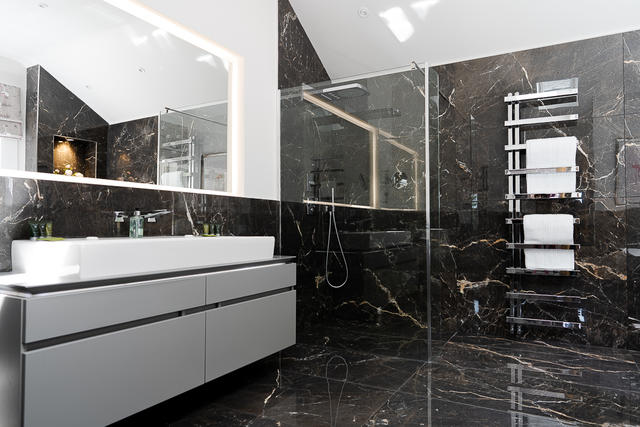 Bedroom 1 luxury en suite with Shower and Bath